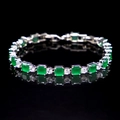 Elegant silver bracelet with green square and white round zirconia on black reflective surface - Malay Jade Green