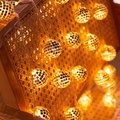 Disco ball LED string lights with warm amber glow on a woven vine chair for decoration - 3m 20-LED Battery Powered