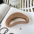 Close-up of a large beige matte shark hair claw clip on a stylish magazine backdrop - Butterfly Buckle 10cm / Deep Nude Pink