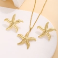 Macro shot of golden starfish jewelry set with textured necklace and earrings - Textured Starfish Shape Style (E3764)