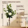 Detail of white artificial camellia petals with lush green leaves and soil stake - White