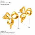 Macro view of gold-plated stainless steel bow earrings featuring a central pearl accent - Bowknot Design Style (SE535G)