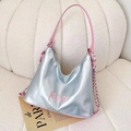 Silver PU leather hobo bag with pink trim and chain strap on a white plush sofa - Silver
