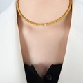 Gold beaded titanium steel necklace with a single zircon pendant shown on a model - Necklace (35+5cm) / Gold