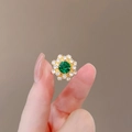 Vintage sunflower stud earrings with large green gemstone and white crystal halo - Green Sunflower