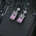Elegant flower stud earrings with pink rectangular gemstone on black leather box - Pink Rhinestone Flower (4956590996936) / Pink Zircon Palladium White Plated