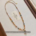 Collana etnica con perline e ciondolo tondo dorato, pietre occhio di tigre, 41.5cm - Collana-Caffè