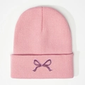 Sweet pink knitted beanie hat with purple embroidered bow design in casual Korean style - One Size / Dusky Pink