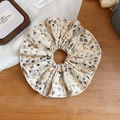 Chic floral fabric scrunchie in beige with lace trim and elegant ruffles on wood - Scrunchie / White Floral