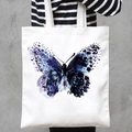 White canvas tote bag featuring an artistic blue and purple watercolor butterfly print - Blue-Purple Butterfly (STD707-S)