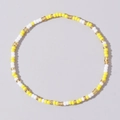 Beaded bracelet with yellow, white and translucent gold mini beads in a closed loop - Yellow White Gold