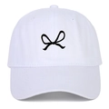 Close-up of black ribbon bow embroidery on a premium white cotton baseball cap fabric - White