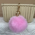 Pink faux fur pompom keychain with golden metal ring and lobster clasp for handbags - Pink