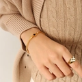 Golden star spring bracelet with black heart checkerboard ring jewelry set on wrist - Gold Color Bracelet