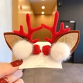 Detail of festive reindeer antler hair clips with plush balls and glitter ears on card - Red Antlers with Pom Pom Ears Pair