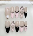Detail view of 10pcs long almond press-on nails with pink plaid, hearts and rhinestones - 10 Pieces XS / Pink Black Sweetheart