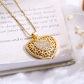 Minimalist hollow heart necklace with sparkling zircon pendant on vintage book background - Gold White Zirconia
