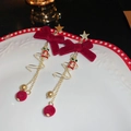 Close-up of Christmas tassel earrings with red velvet bows and golden stars on white plate - 32# Silver Pin - Gold - Red