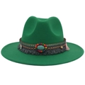 Detail of bohemian hat band featuring turquoise stones and ethnic tassels on green felt hat - Grass Green