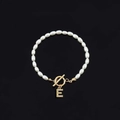 Faux pearl beaded bracelet featuring a gold OT clasp and a sparkling letter E charm - Gold Letter E (SL2013)