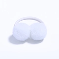 Detail showing two white fluffy pom poms on a high-elastic hair tie for kids - White