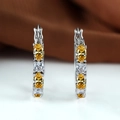 Silver-plated hoop earrings featuring alternating yellow and clear oval-cut zirconias - Yellow