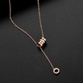 Rose gold titanium Y-necklace with Roman numeral rings and zircon inlay pendant - Waistline Cylinder Necklace
