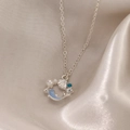 Silver necklace with blue whale tail, white pearl and shell charms on silk background - Bright Silver Necklace (DZ-482)