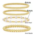 Set of 4mm and 5mm hematite gold bead bracelets with white pearls on white background - Set 04 Gold (4pcs/Pearl)