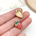 Macro detail of strawberry pendant showing red rhinestones and golden textured back - KC Gold Red Rhinestone Strawberry (23416)