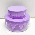 Close-up of a purple two-tier cake storage box with realistic dripping cream decorations - Purple