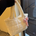 Close-up of a white quilted puffer tote bag featuring a pink plaid bow charm detail - Without Pendant / Cream White
