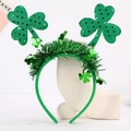 Detailed view of St. Patrick's Day headband with green shamrocks and glitter tinsel - Small Sequin Shamrock Headband