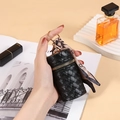 Black woven mini coin purse with gold zipper and stylish printed silk scarf detail - Black