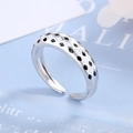 Macro view of adjustable silver ring featuring black and white checkered enamel patterns - Adjustable Open / White Gold Plated Copper