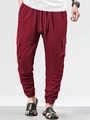 Detail view of wine red cargo pants showing waffle texture fabric and drawstring waist - S / Bottoms / Burgundy