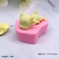 Pink silicone mold with yellow 3D reindeer figure, size 7x5.1x2.5cm for DIY crafts - Prone Sleepy Fawn