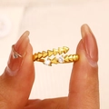 Adjustable golden stud ring with two round clear cubic zirconia accents in macro view - Gold Studded Spike Open Ring (WG-0019)