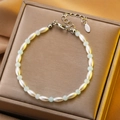 Beaded pearl bracelet with light blue accents and durable stainless steel clasp - Stainless Steel Blue White Rice Bead Bracelet (10848)