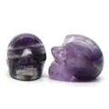 Natural dream amethyst hand-carved crystal skull figurines with purple banded texture - Amethyst