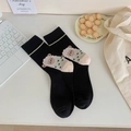 Black crew socks with sheep motif and green accents, knitted from premium combed cotton - One Size / Alpaca