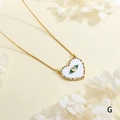 Detailed macro view of gold heart necklace with zircon evil eye pendant and dried flowers - Heart Evil Eye Style (NE2255-G)