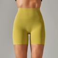 Close-up of high-waist lime yoga shorts showing elastic fabric texture and slimming fit - Light Lime