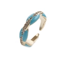 Close-up of adjustable gold ring with sky blue enamel and sparkling cubic zirconia stones - Adjustable / Light Blue