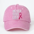 Pink washed denim baseball cap featuring white Never Give Up embroidery and pink ribbon icon - Pink