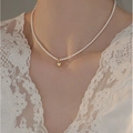 Elegant white freshwater pearl necklace featuring a polished golden heart pendant for women - Shell Pearl Heart Necklace
