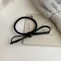 Elegant black leather bow hair tie with elastic rope and a hexagonal silver pendant - Black Hair Tie