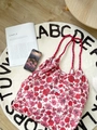 Floral canvas tote bag in red rose print with drawstring straps and label details - French Rose