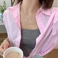 Silver heart pendant necklace with textured finish worn on a pink shirt outfit - Textured Heart Style (XL2697)