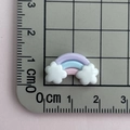 Gedetailleerde maatreferentie van 2 cm regenboogwolkbedeltjes op een meetraster-schaal - Paars Blauw Roze